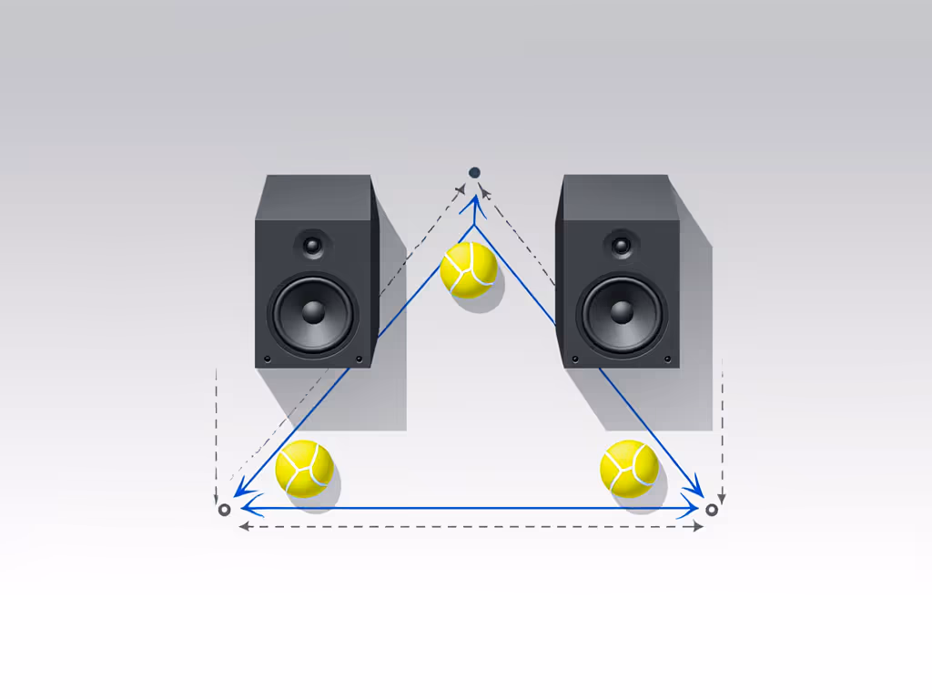 simple_speaker_placement_diagram_showing_triangle_formation_and_tennis_balls_under_speakers